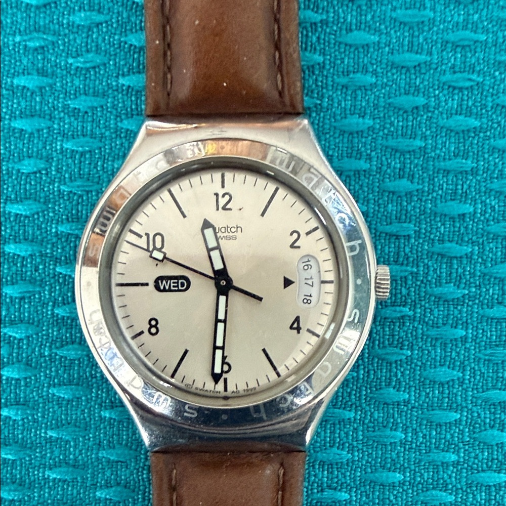 Swatch Watch with brown leather band and silver bezel
